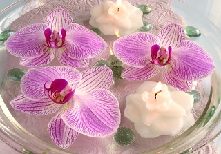 Floating orchid flowers and candles Floating orchid flowers and candles